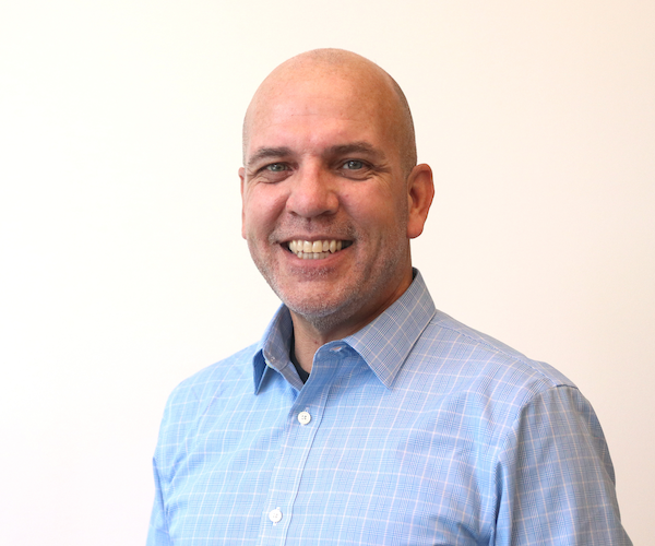 A headshot of Andy Johnston.