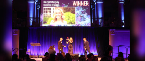 Margot Murphy accepts her PR Week Award on stage.